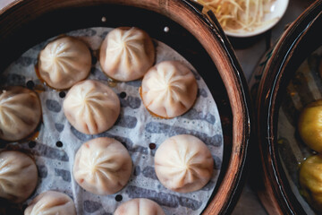 Fresh Dumplings in Traditional Round Chinese bamboo plate 