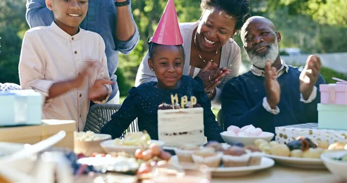 Child, happy birthday and clapping in outdoor celebration, party and cake or candles at park. Black family, happiness and support for daughter, cheers and event or together, garden and food or love
