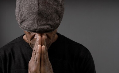praying to God with the bible on black background with people stock image stock photo