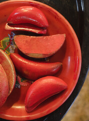 Moon shaped red wooden blocks (jiaobei) with one flat and one curved side in Buddhist Temple