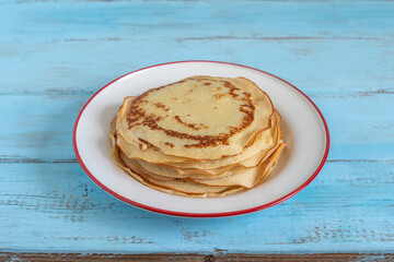 Maghrebi Jewish pancakes Mofletta. Mofletta eating during Mimouna celebration after Jewish holiday Passover.