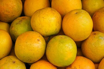 Indonesian local citrus fruit that tastes sweet and the color is a mixture of orange and green....
