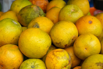 Indonesian local citrus fruit that tastes sweet and the color is a mixture of orange and green....