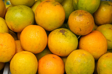 Indonesian local citrus fruit that tastes sweet and the color is a mixture of orange and green. This fruit is widely sold at a low price. This orange is not inferior in quality to imported oranges.