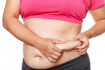 Woman touching his fat belly on white background. Woman hand holding excessive belly fat - obrazy, fototapety, plakaty