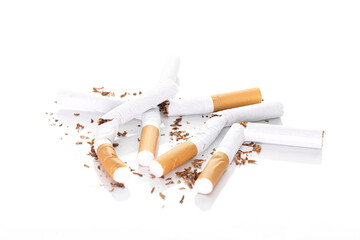 Broken cigarette on white background