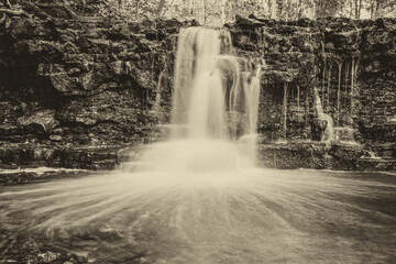 waterfall in the forest, monochrome photography- vintage retro look 