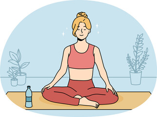 Obraz na płótnie Canvas Calm woman practicing yoga at home