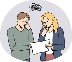 Pensive colleagues brainstorm over paperwork