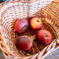 four red apples in the basket