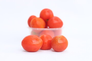 Fresh juicy red tomato isolated on white background. Clipping path