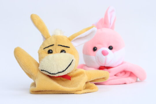 Soft hand puppet toy on a white background. Puppet show concept.