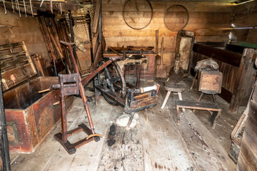 Fototapeta na wymiar Historic shed with various rural tools objects and objects