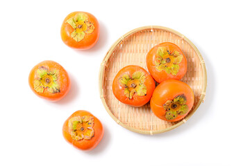 ザルに盛られた愛知県豊橋市産の次郎柿