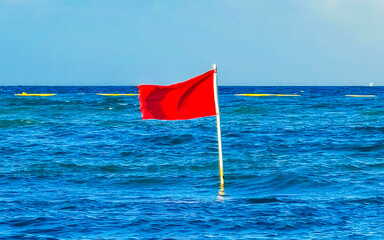 Red flag swimming prohibited high waves Playa del Carmen Mexico.