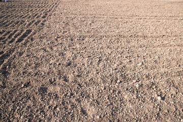 Brown crushed soil peat field abstract texture may be used as a  background wallpaper
