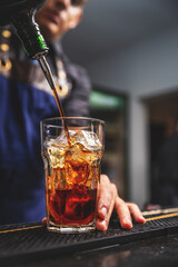 Barman pouring liquor