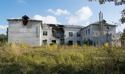 Fototapeta na wymiar The Russian-Ukrainian war, a house damaged by artillery fire. Luhansk region