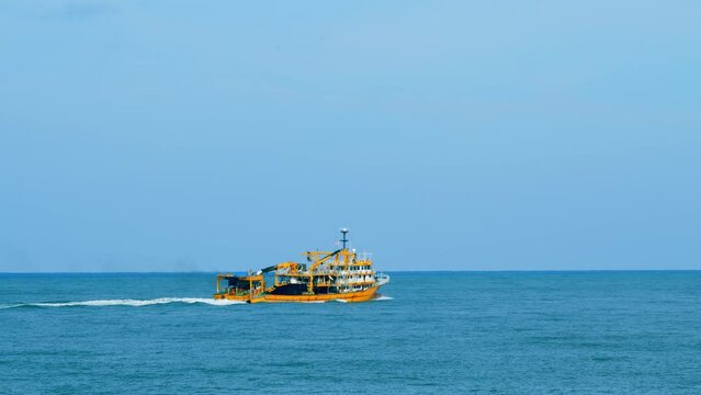 Fishing Ship In The Calm Sea. Fishing Boat Out In The Ocean Or Sea Wide. Real time.
