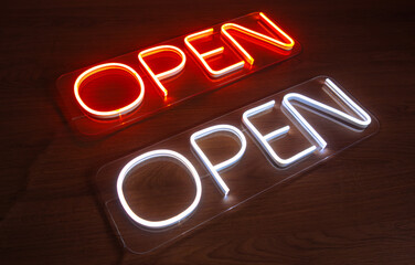 Two signs made of flexible neon with the inscription open. Production of light advertising for...