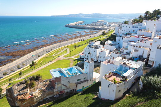 A panoramic view of the old city of Tangier with a view of the sea and the port