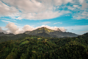 Fototapeta na wymiar Sunrise over mountainous Martinique aerial 