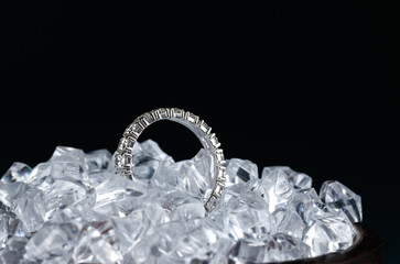 Gold ring with diamond in pieces of ice.