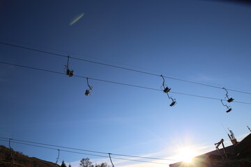 A cable car climbs the mountain