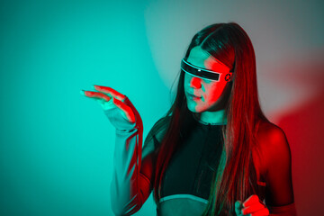 Fototapeta premium Futuristic transgender person using augmented reality smart goggles