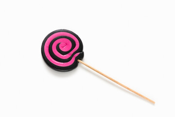 Black and pink lollipop swirl on white isolated background