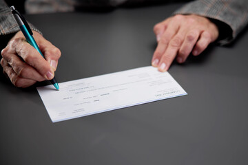 Confident Woman Writing Bank Cheque