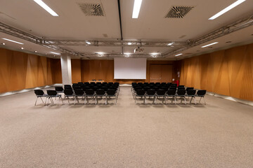 Empty chairs in large Conference hall for Corporate Convention or business summit