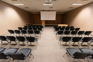 Empty chairs in large Conference hall for Corporate Convention or business summit