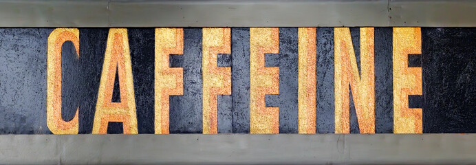 Generic 'Caffeine' sign with vintage retro style lettering. Banner header image.