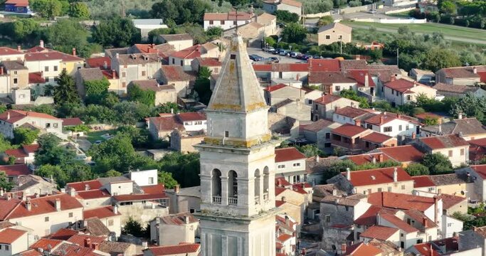 Drone video of the historic Croatian town of Voznjan in Istria with church bell tower