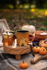 Autumn composition with a cup of warm drink