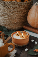 Autumn composition with a beautiful candle