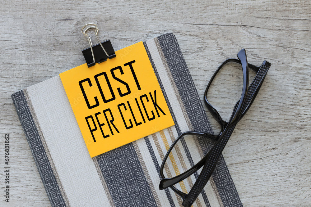 Poster cpc cost per click. cpc cost per click message on a computer keyboard on a sticky note