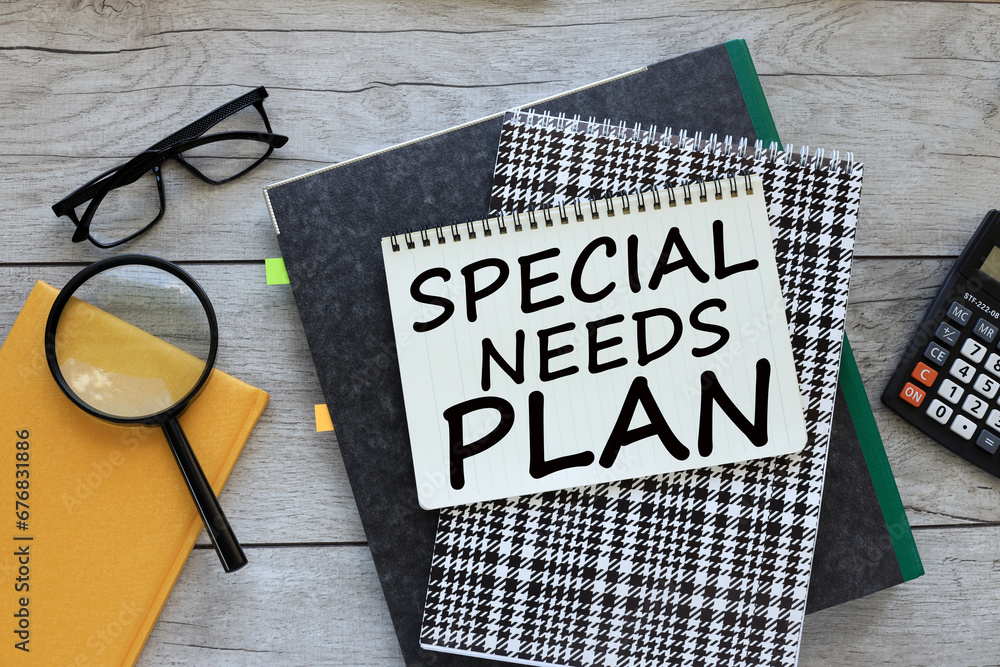 Poster special needs plan . text on notepad page. workspace with folder and magnifying glass on yellow note