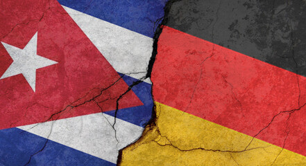 Flags of Cuba and Germany, texture of concrete wall with cracks, grunge background, military conflict concept