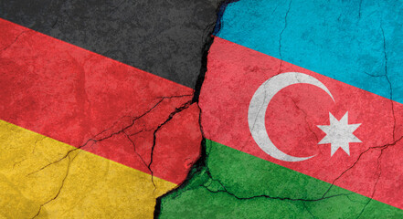 Germany and Azerbaijan flags, concrete wall texture with cracks, grunge background, military conflict concept