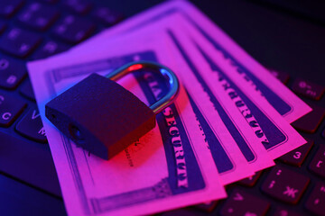Padlock and social security card on computer keyboard close up. Identity theft and identity...