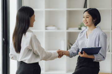 Business handshake for teamwork of business merger and acquisition,successful negotiate,hand shake,two businessman shake hand with partner to celebration partnership and business deal concept