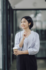 Fototapeta premium Excited happy woman looking at phone screen Celebrate Victory Online Happy young Asian woman