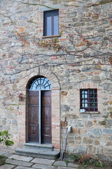 DETAIL OF AN ANCIENT HOUSE IN TUSCANY