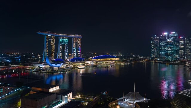 night illuminated singapore city famous downtown marina traffic bay aerial panorama 4k timelapse