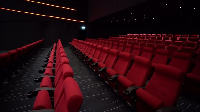 Cinema and entertainment, empty red movie theatre seats for tv show streaming service and film industry production. High quality 4k footage