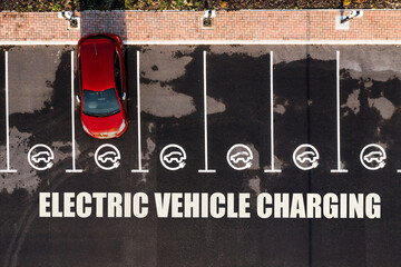 Aerial view of an electric car charging station with parking spaces