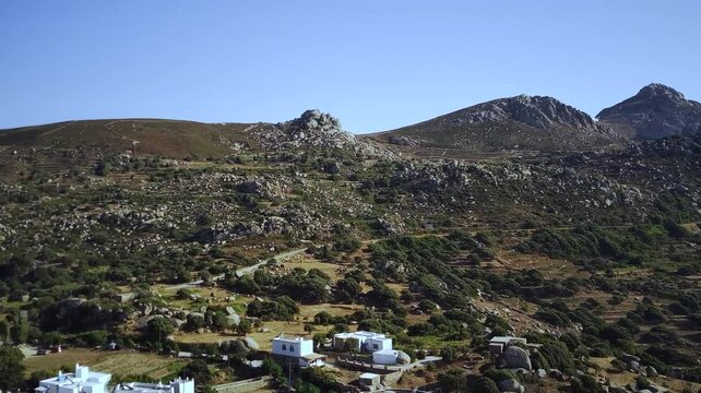 Drone footage of Volax mountain village surrounded by granite boulders in Tinos island, Greece