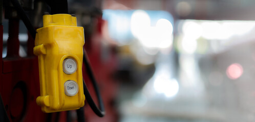 Fototapeta premium Overhead crane control switch at factory warehouse Close-up pictures of industrial work